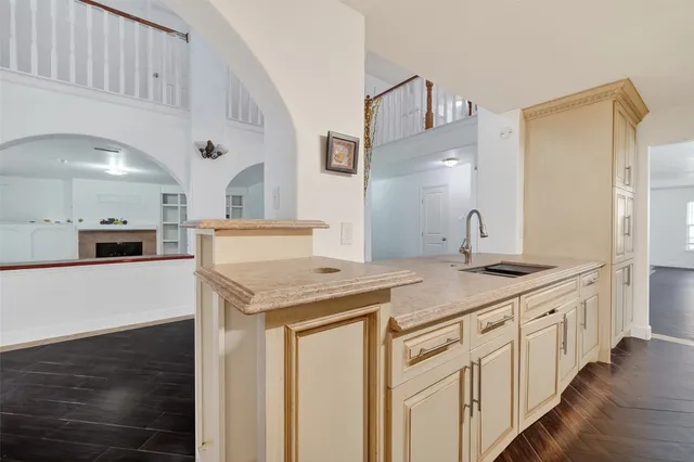 a kitchen with stainless steel appliances granite countertop a sink and cabinets