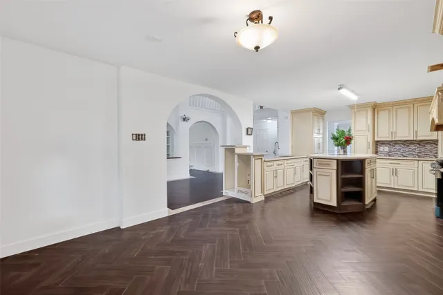 a view of a kitchen with a sink cabinets and wooden floor