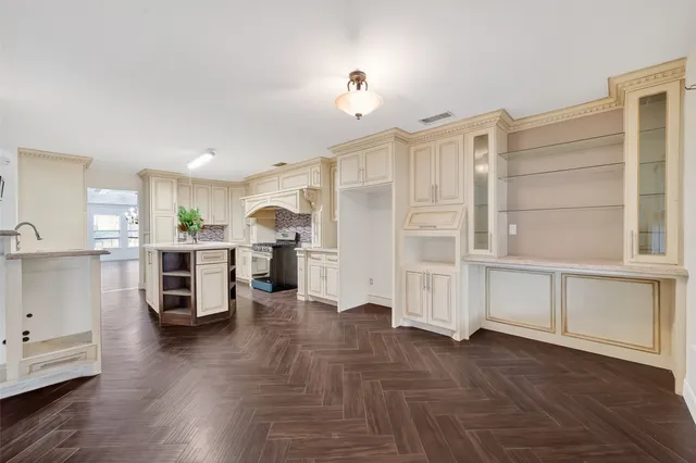 a view of a kitchen with wooden floor and a kitchen
