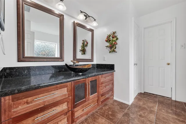 a kitchen with stainless steel appliances granite countertop a sink and a granite counter tops