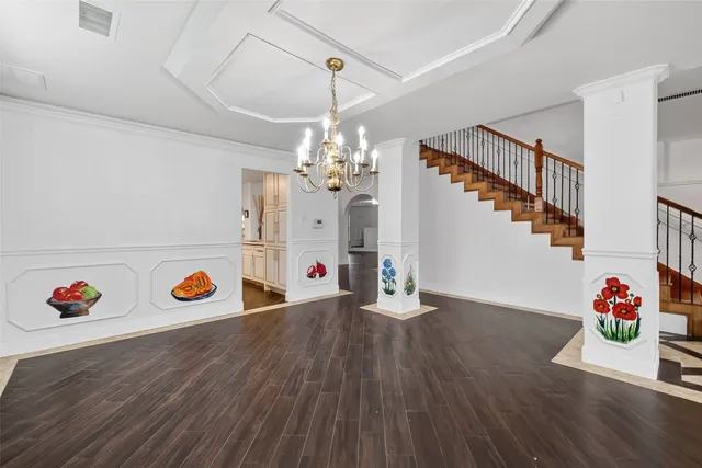 a hallway with wooden floor and book shelf