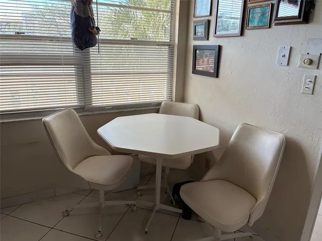 a bathroom with a toilet and a mirror