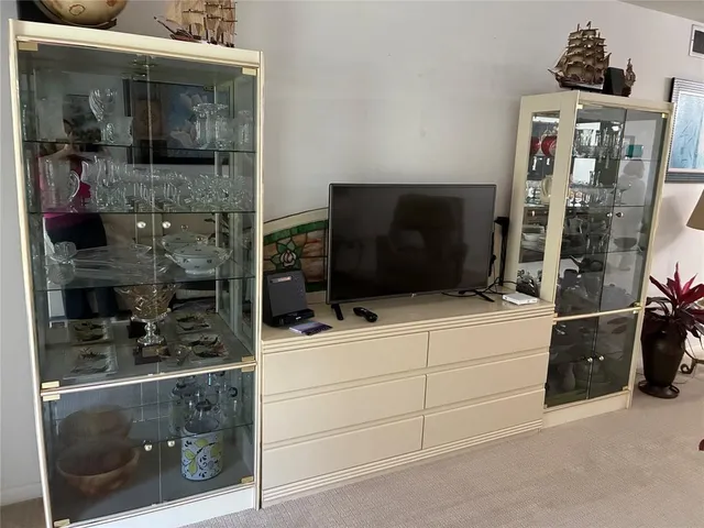 a bathroom with a walk in closet and a mirror