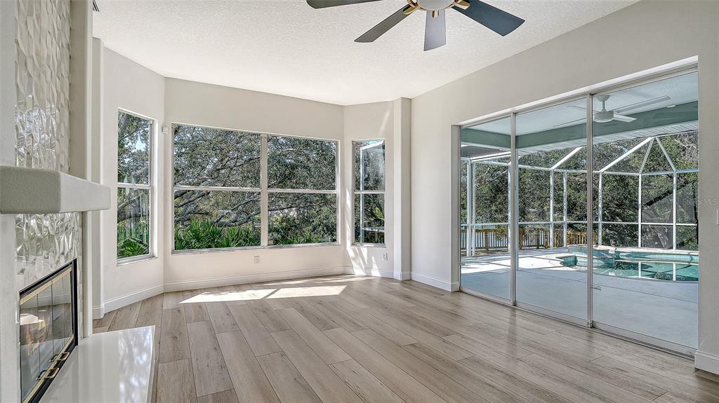 5402 Caruso Road Bradenton, FL 34203 - Photo 33 of 84 a view of empty room with wooden floor and fan