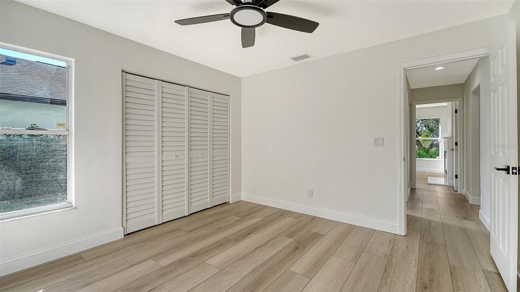 5402 Caruso Road Bradenton, FL 34203 - Photo 47 of 84 a view of empty room with wooden floor