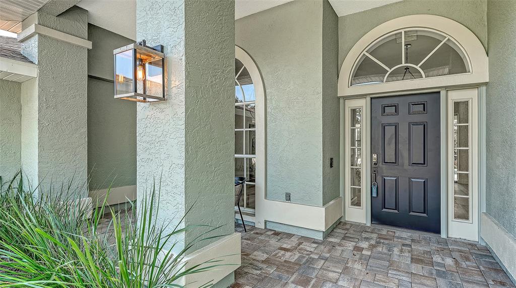 5402 Caruso Road Bradenton, FL 34203 - Photo 8 of 84 a view of front door with a glass door