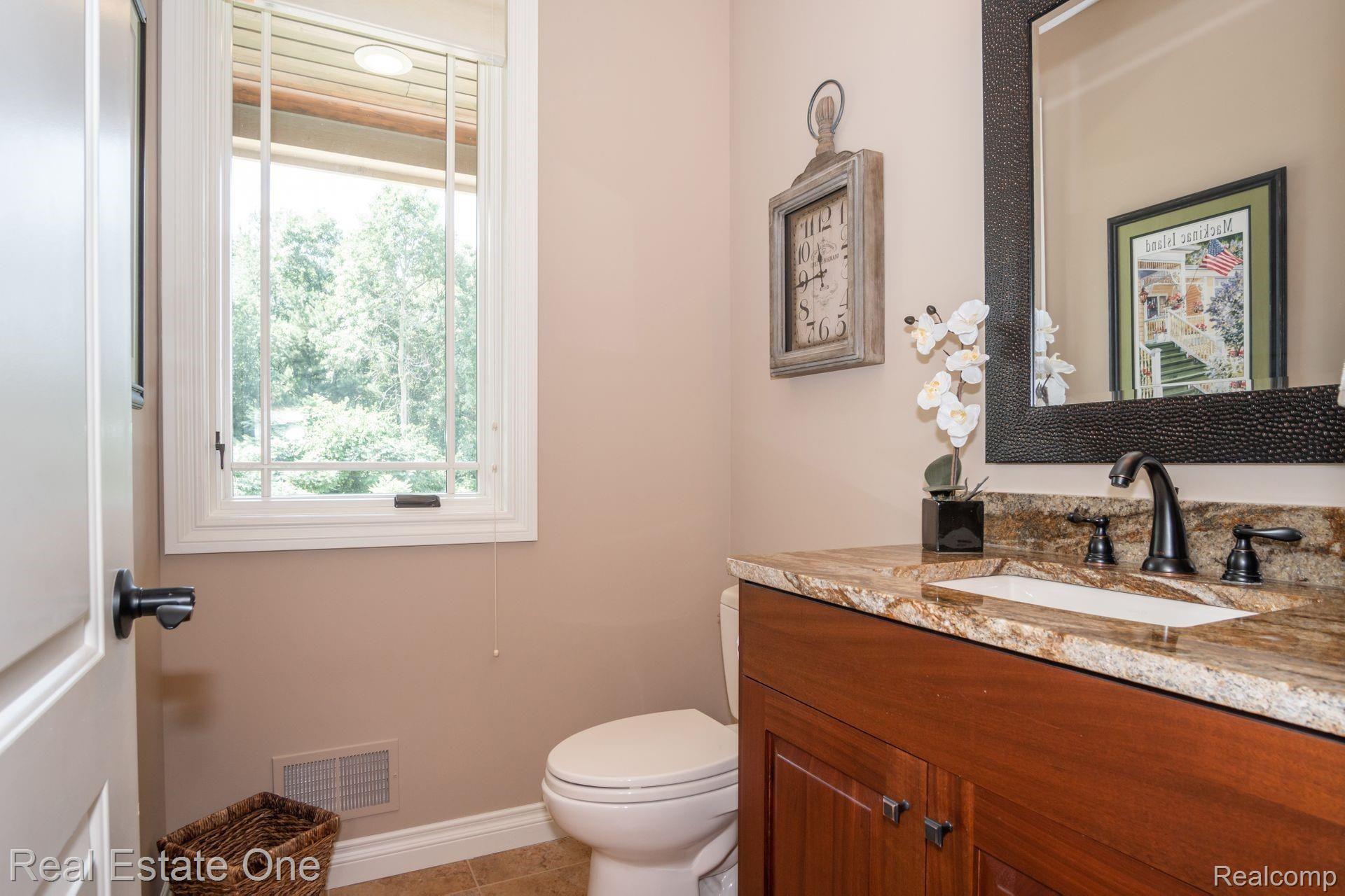 9091 Northpointe Ridge Brighton, MI 48114 - Photo 22 of 56 Half bath on first floor.