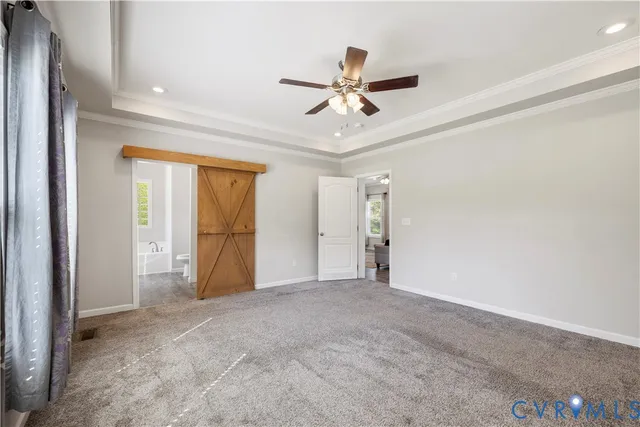 a view of a livingroom with a ceiling fan and window