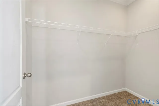 a bathroom with a granite countertop sink mirror bathtub and toilet