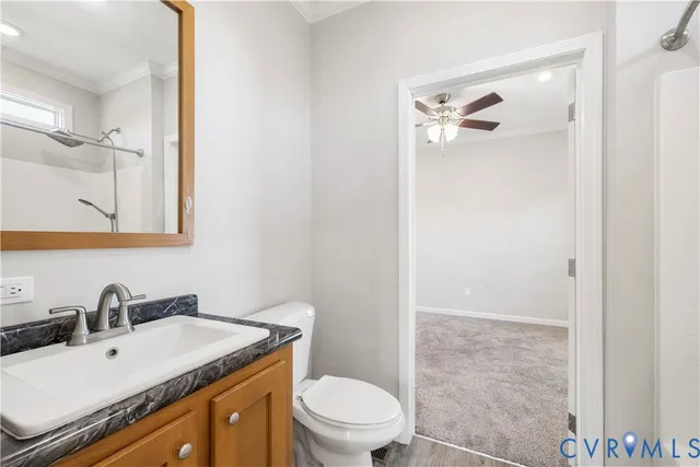 a bathroom with a granite countertop sink and a bathtub