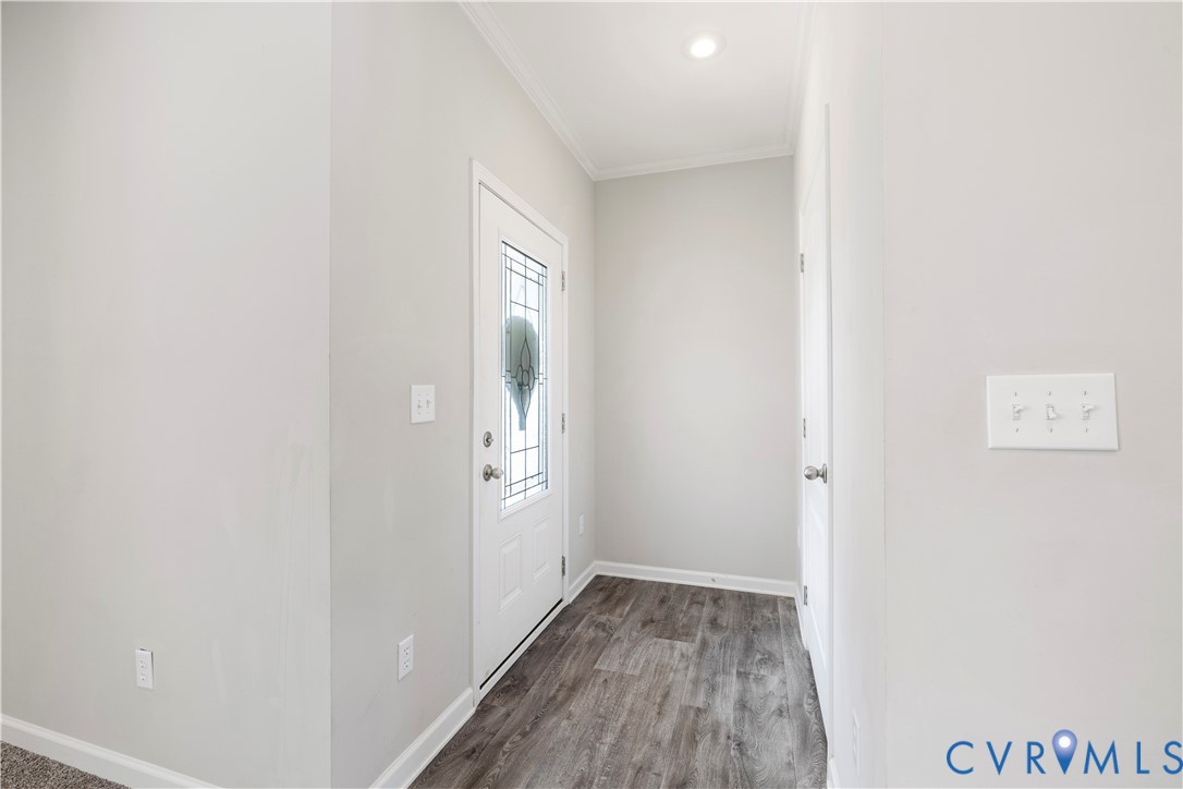 17030 Egglestetton Road Amelia Court House, VA 23002 - Photo 3 of 36 a view of hallway with window and hardwood floor