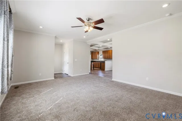 an empty room with closet and windows