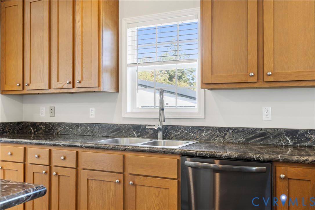 17030 Egglestetton Road Amelia Court House, VA 23002 - Photo 7 of 36 a kitchen with granite countertop cabinets and window