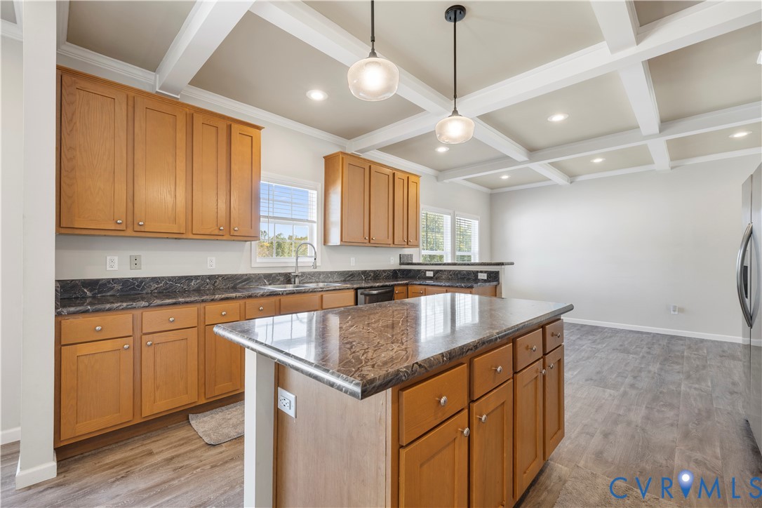 17030 Egglestetton Road Amelia Court House, VA 23002 - Photo 8 of 36 a kitchen with stainless steel appliances granite countertop a sink a stove and a wooden cabinets