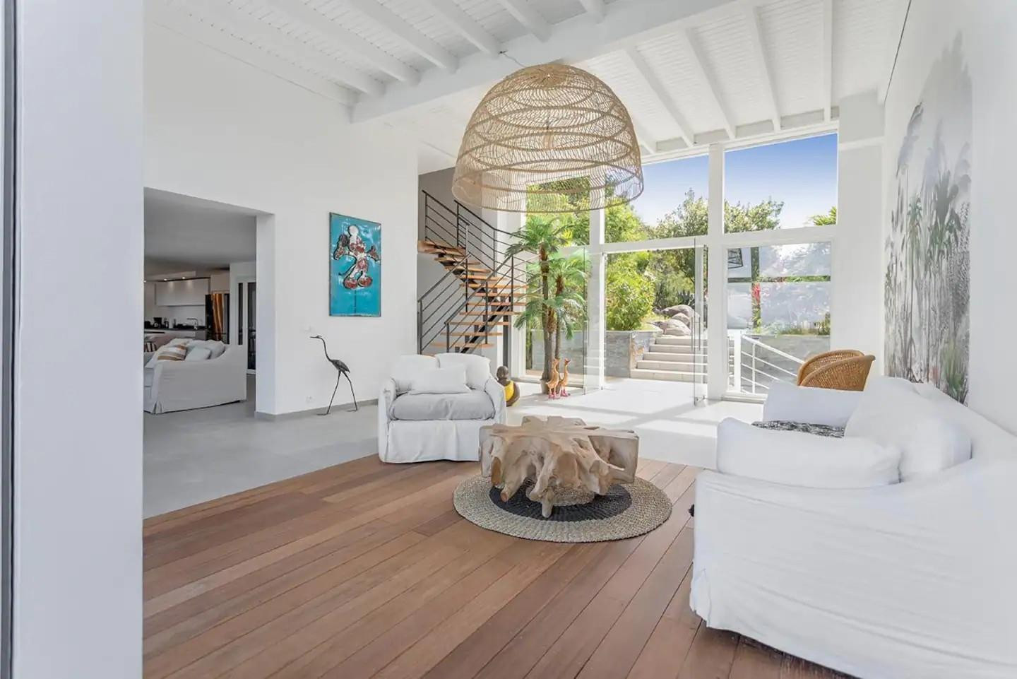 0 Anse Marcel undefined, undefined 00000 - Photo 14 of 15 a living room with furniture and a large window