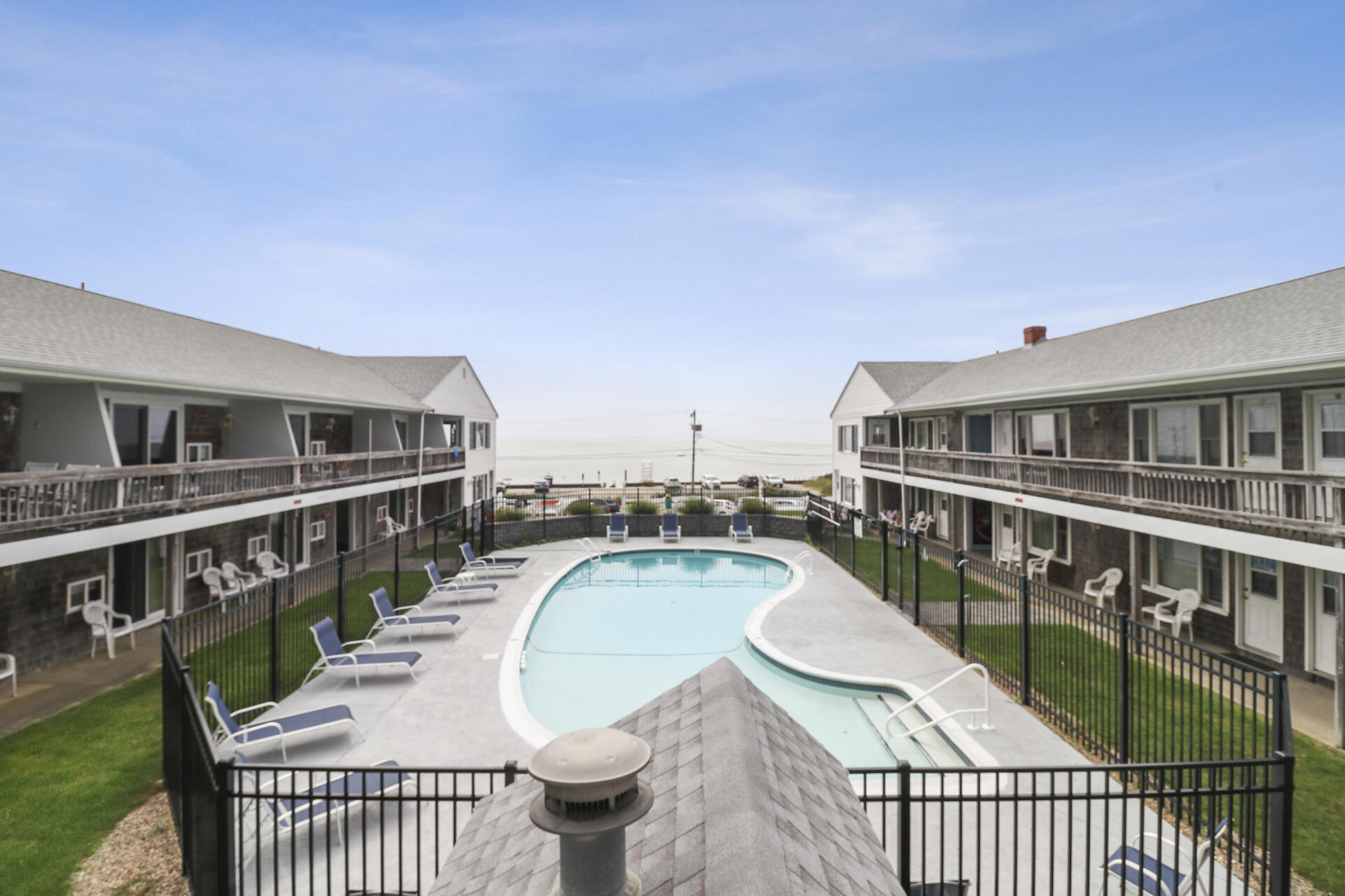 a view of a balcony with chairs