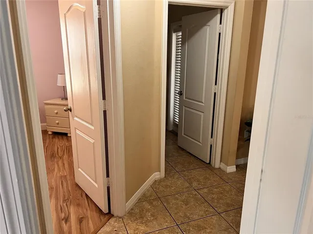 a view of a bathroom from a hallway
