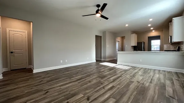 a view of a kitchen from the hallway