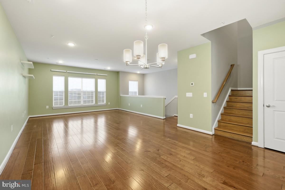 23517 Public House Road, Unit H Clarksburg, MD 20871 - Photo 13 of 49 a view of empty room with wooden floor and window