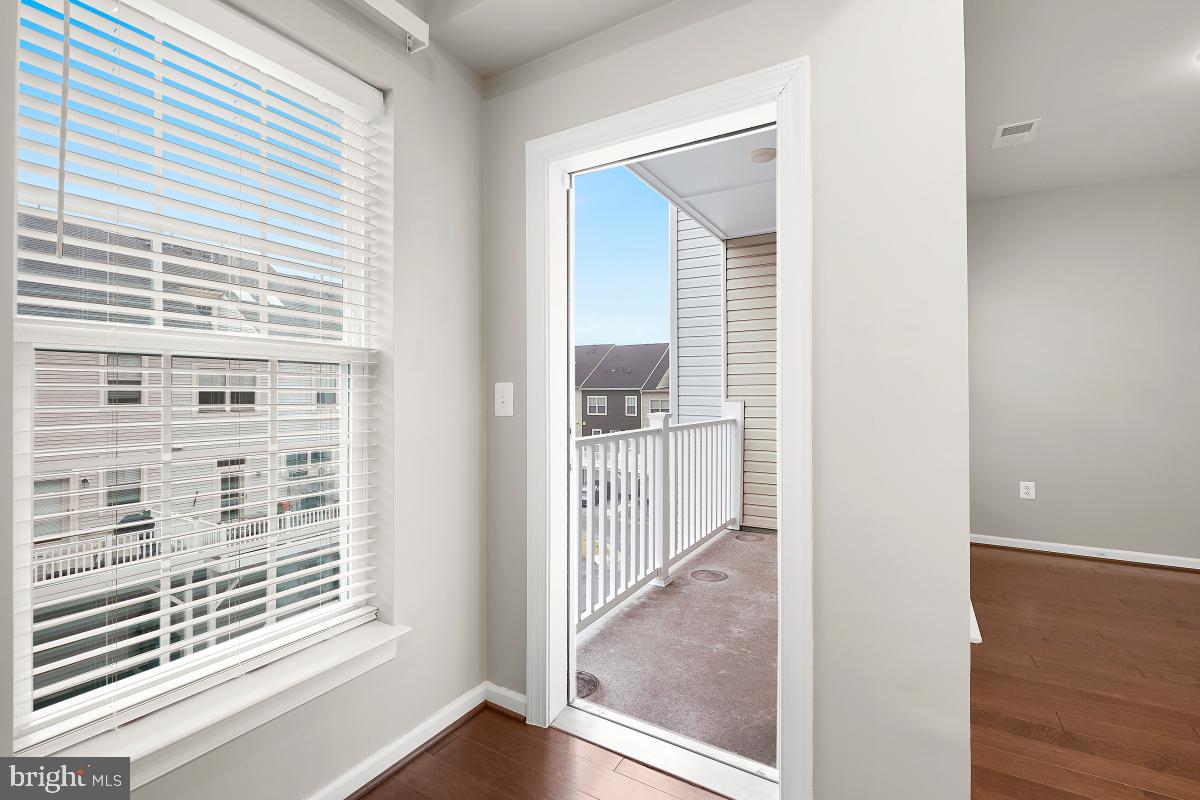 23517 Public House Road, Unit H Clarksburg, MD 20871 - Photo 25 of 49 a view of a hallway with a window