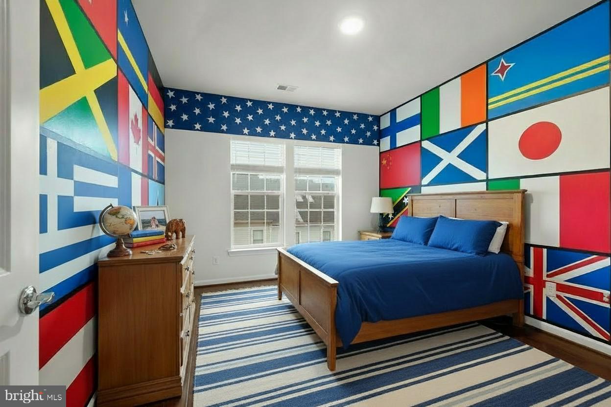 23517 Public House Road, Unit H Clarksburg, MD 20871 - Photo 41 of 49 a bedroom with a bed and wooden floor