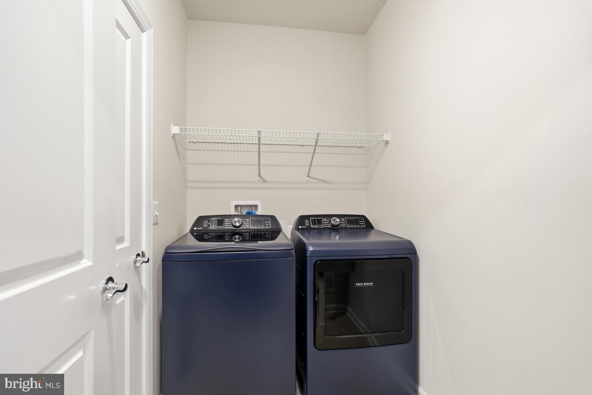 23517 Public House Road, Unit H Clarksburg, MD 20871 - Photo 44 of 49 a view of storage and utility room with washer and dryer