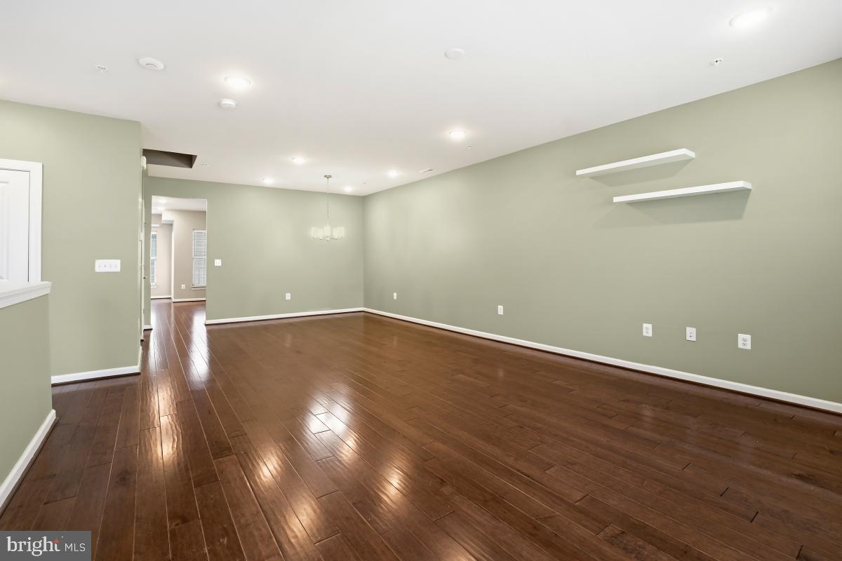 23517 Public House Road, Unit H Clarksburg, MD 20871 - Photo 6 of 49 a view of a room with wooden floor