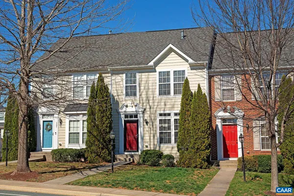 a front view of a house with yard