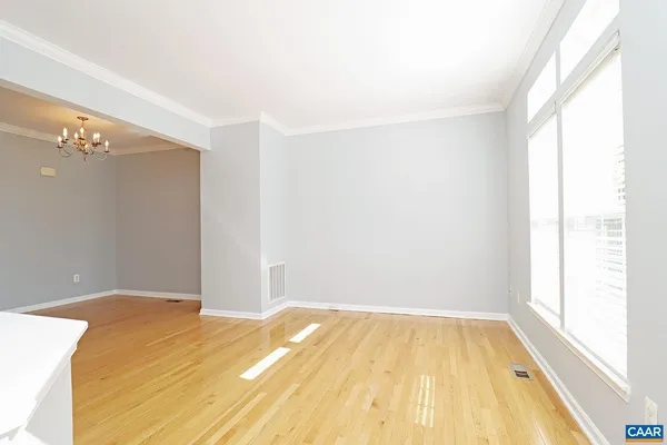 a bedroom with a bed and the window