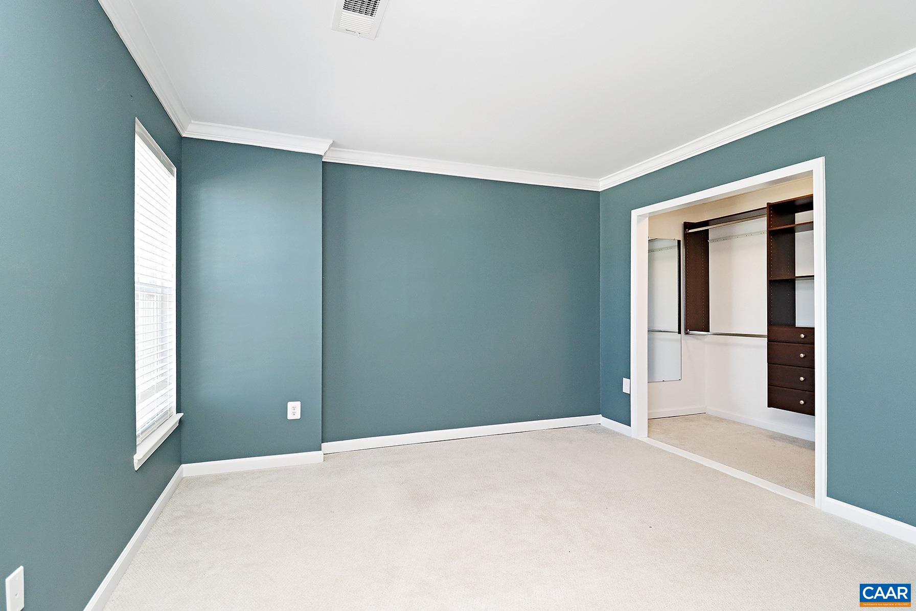 339 Rolkin Road Charlottesville, VA 22911 - Photo 8 of 22 a bedroom with a bed and a window