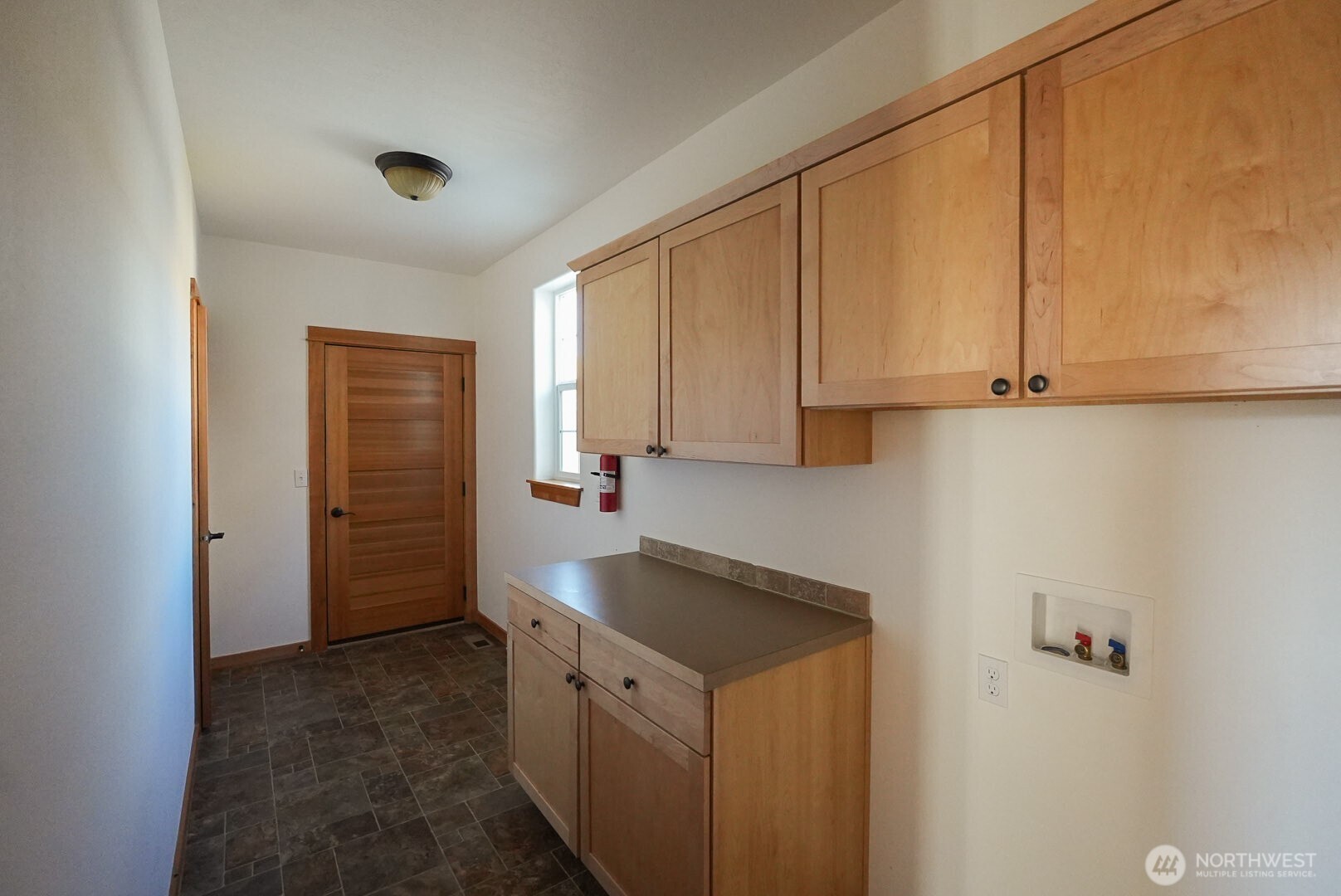 239 South Patit Road Dayton, WA 99328 - Photo 21 of 30 a view of a kitchen with white cabinets