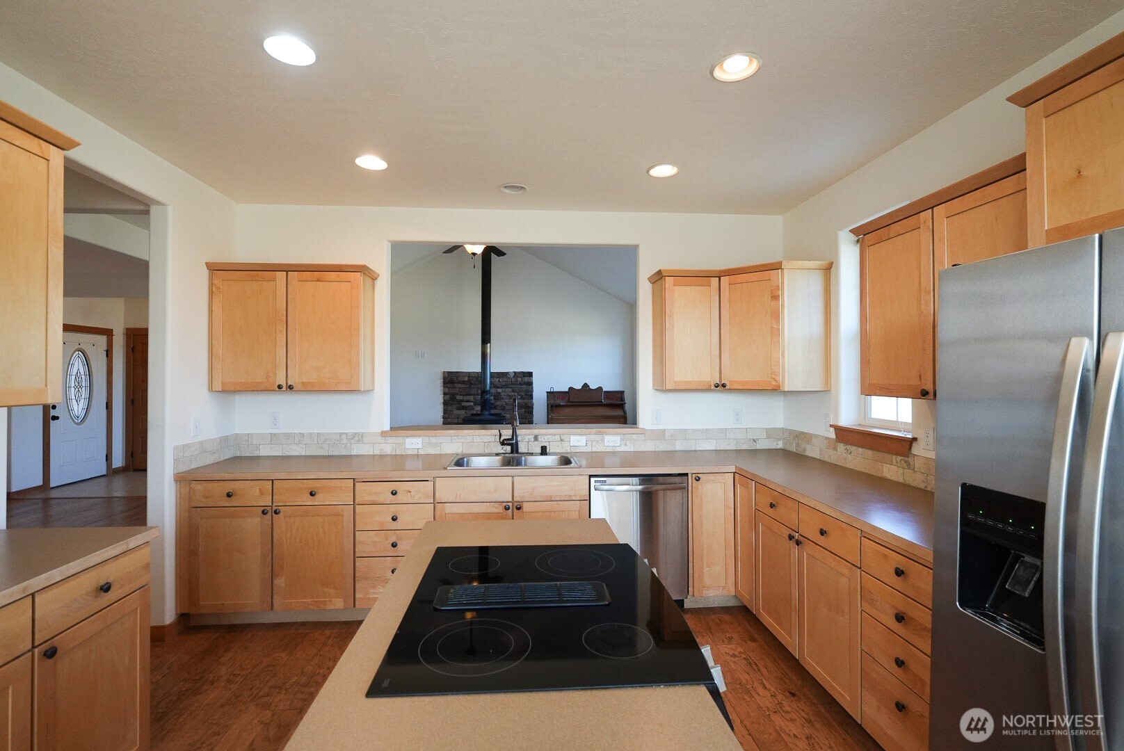 239 South Patit Road Dayton, WA 99328 - Photo 10 of 30 a kitchen with a sink a stove a refrigerator and cabinets