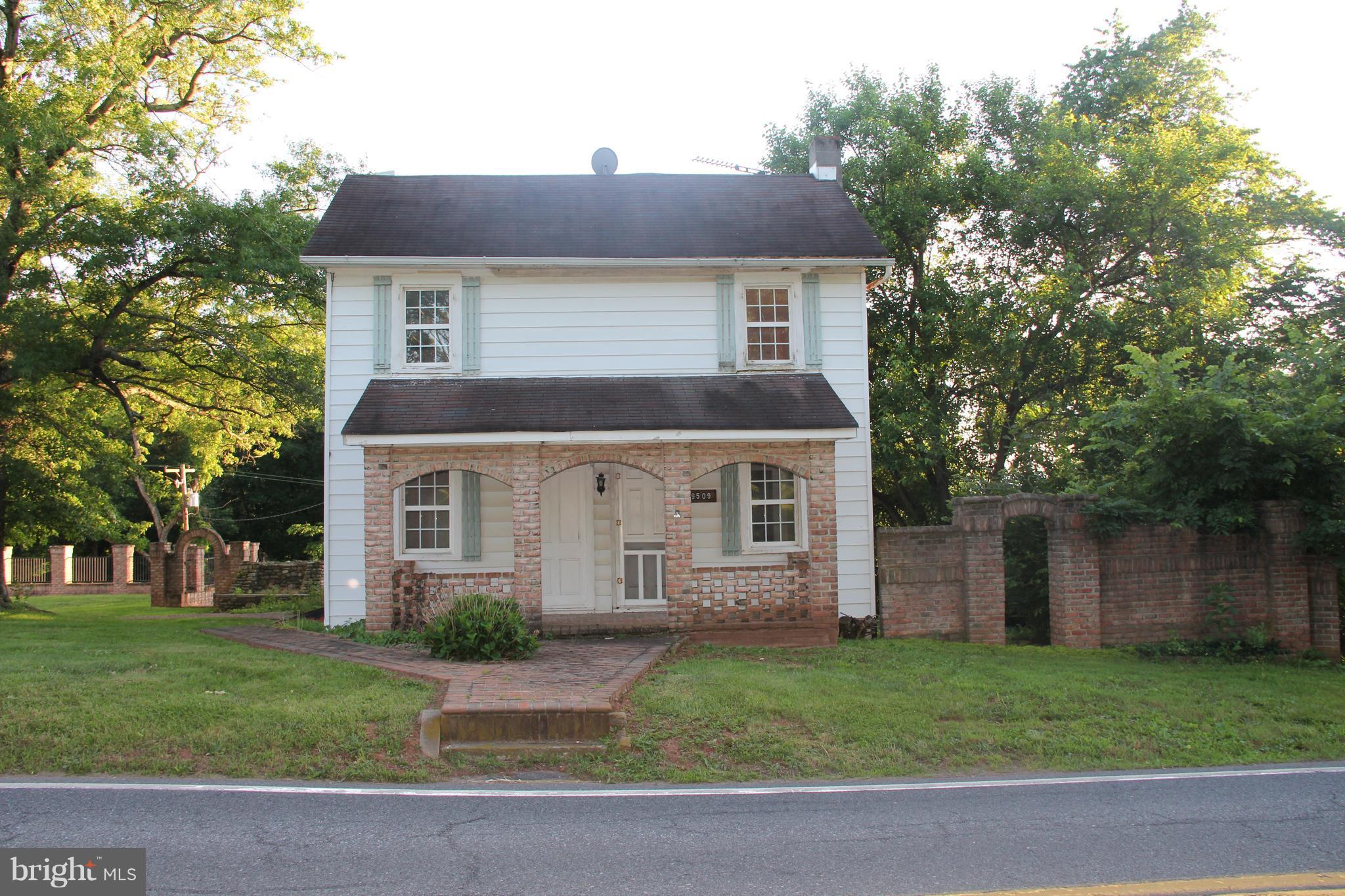9509 Rocky Ridge Road Rocky Ridge, MD 21778 - Photo 2 of 25 front view of a house and a yard
