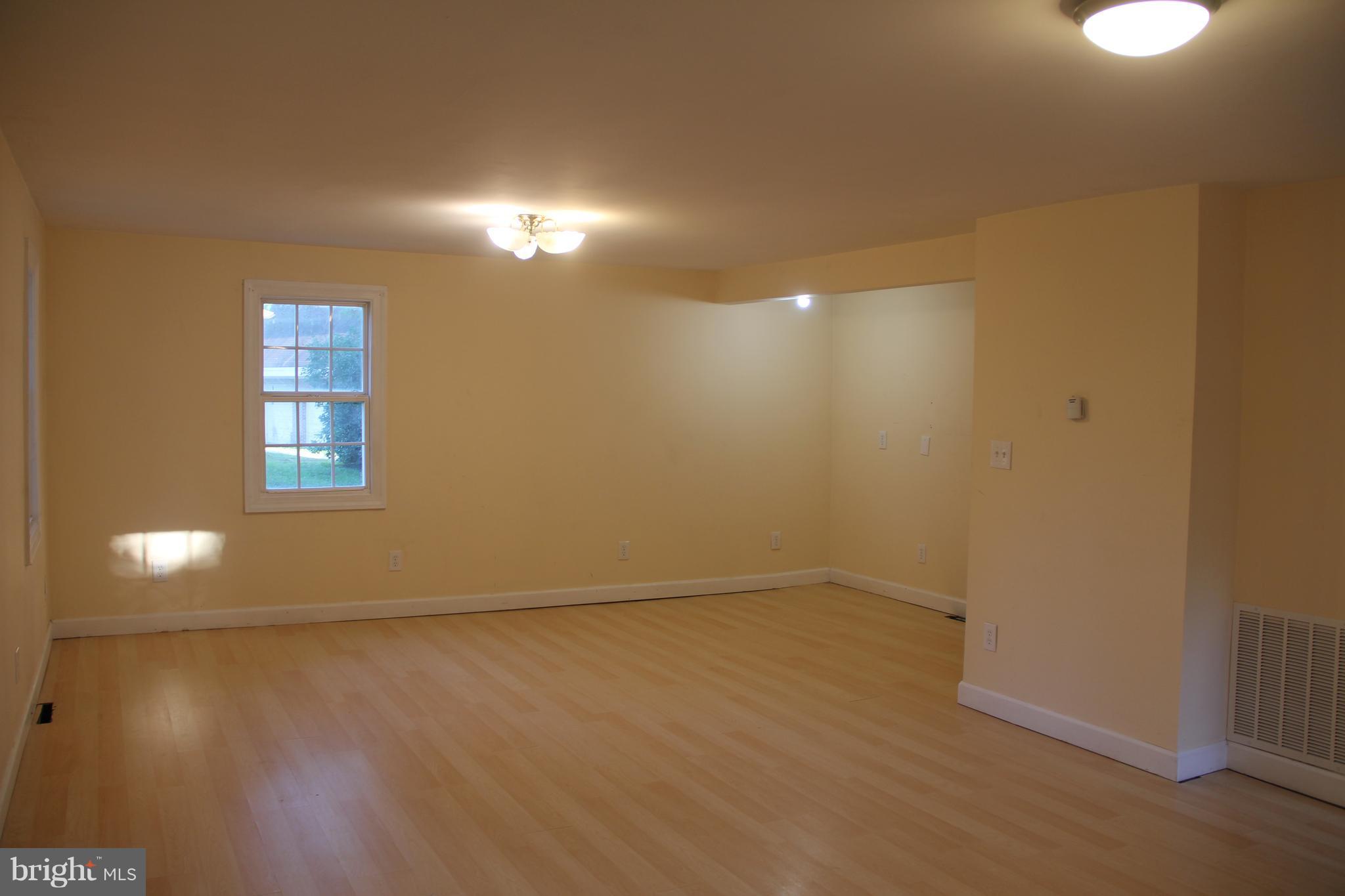 9509 Rocky Ridge Road Rocky Ridge, MD 21778 - Photo 14 of 25 a view of empty room with wooden floor