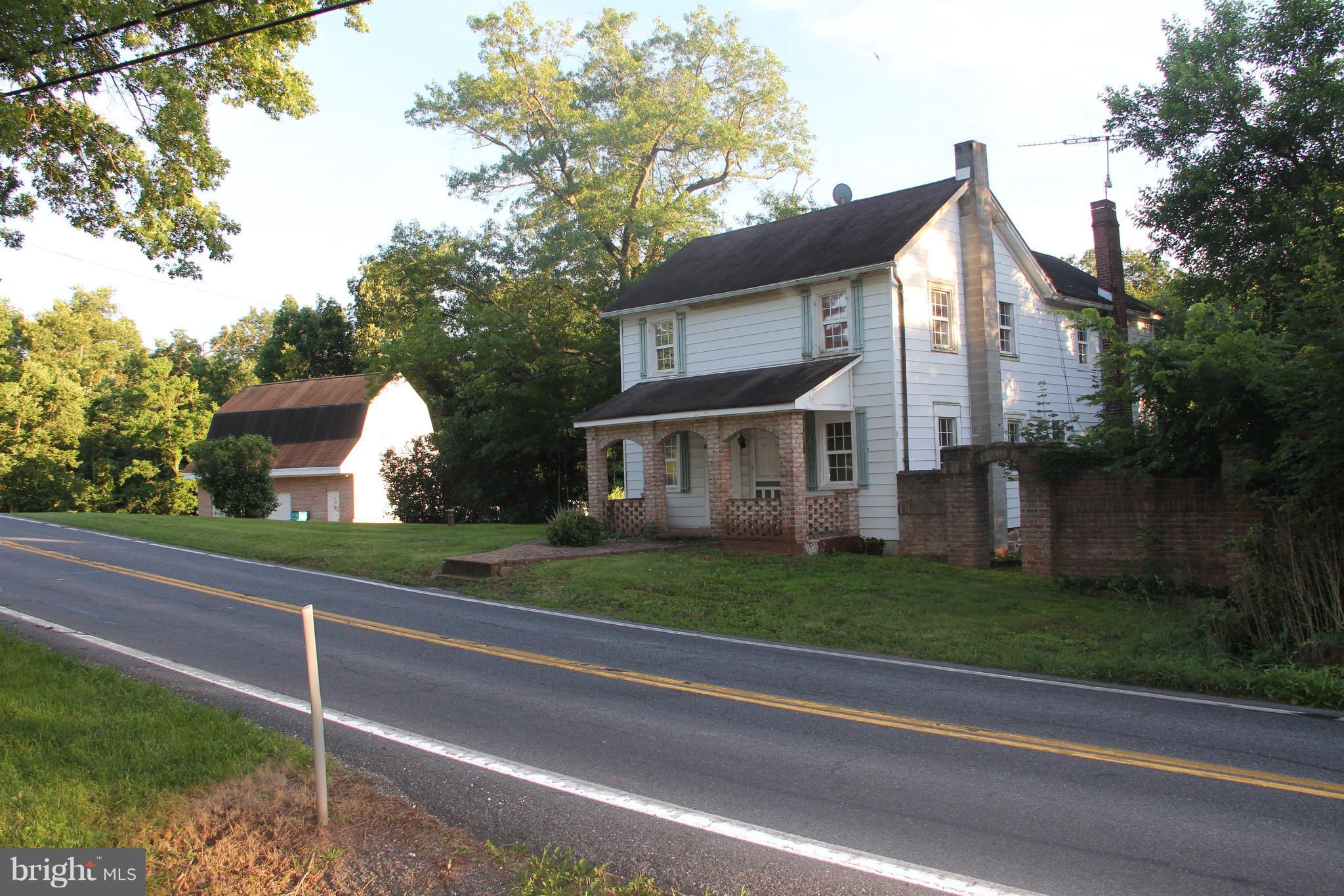 9509 Rocky Ridge Road Rocky Ridge, MD 21778 - Photo 3 of 25 a front view of a house with a yard