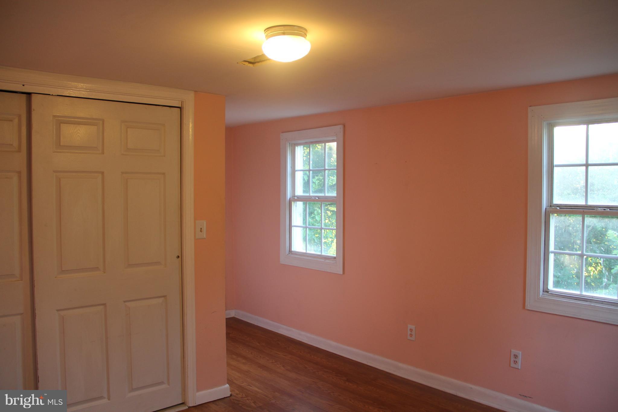 9509 Rocky Ridge Road Rocky Ridge, MD 21778 - Photo 21 of 25 an empty room with windows