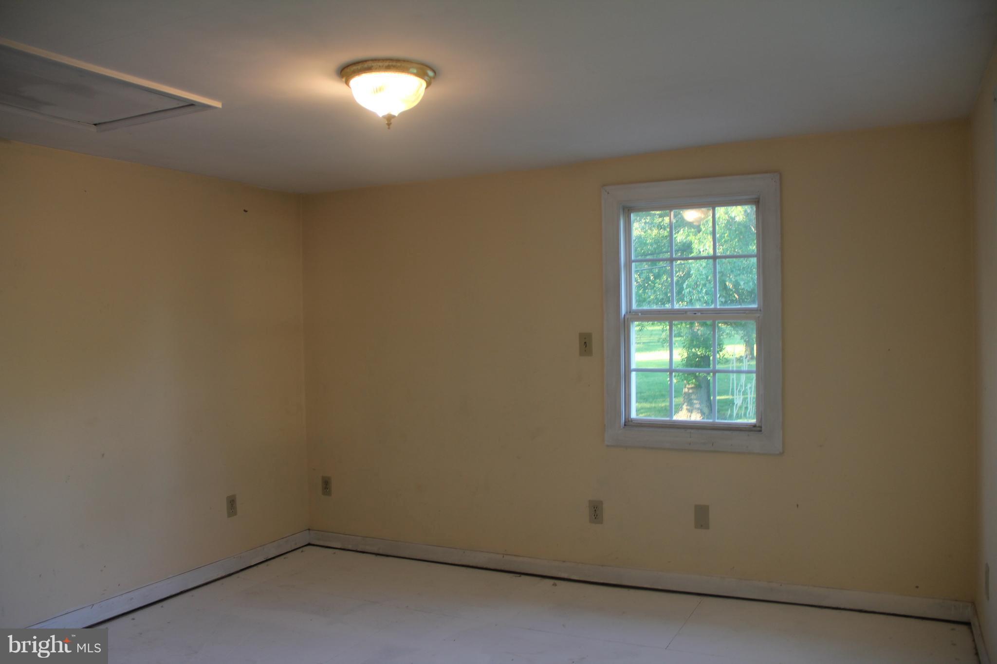 9509 Rocky Ridge Road Rocky Ridge, MD 21778 - Photo 23 of 25 an empty room with a window
