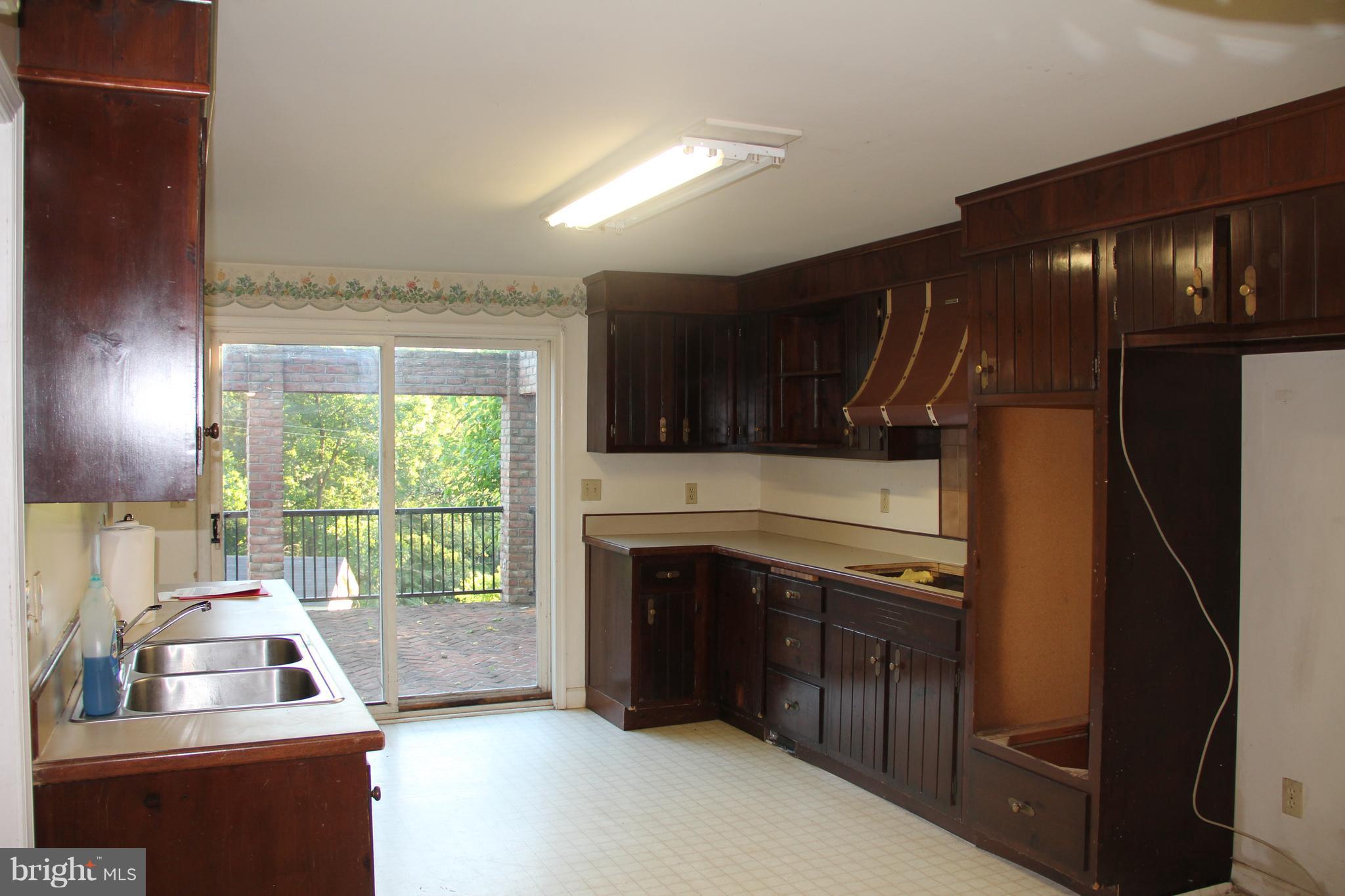 9509 Rocky Ridge Road Rocky Ridge, MD 21778 - Photo 10 of 25 a kitchen with furniture and a window