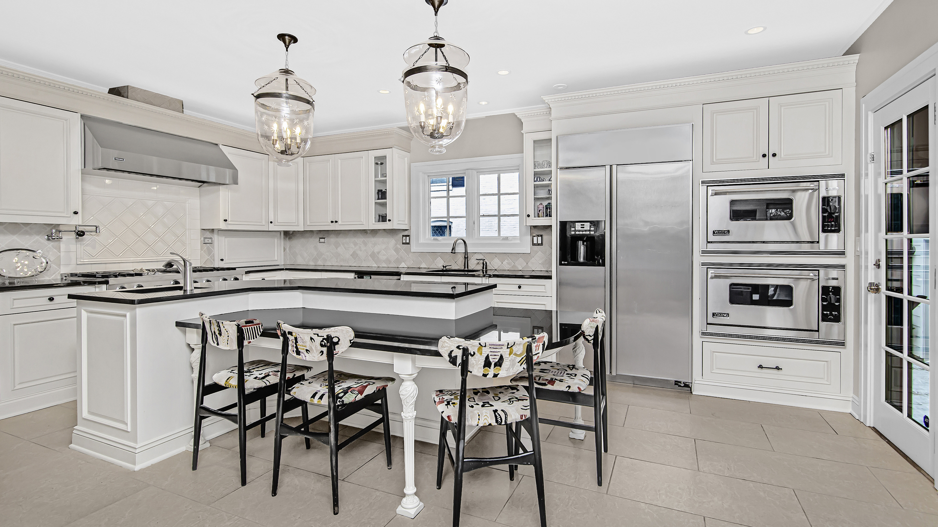 159 Fuller Lane Winnetka, IL 60093 - Photo 6 of 13 a kitchen with granite countertop a refrigerator oven a stove a dining table and chairs with wooden floor