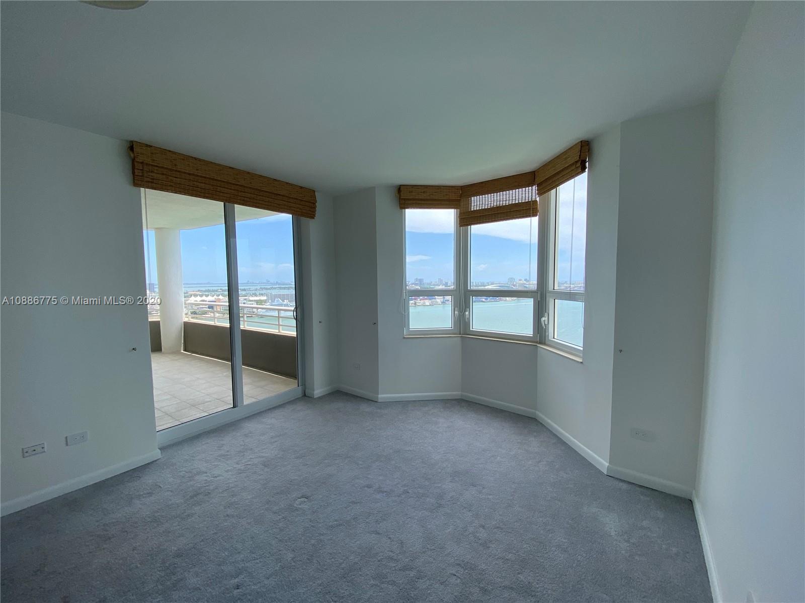 808 Brickell Key Drive, Unit 2601 Miami, FL 33131 - Photo 14 of 29 an empty room with windows
