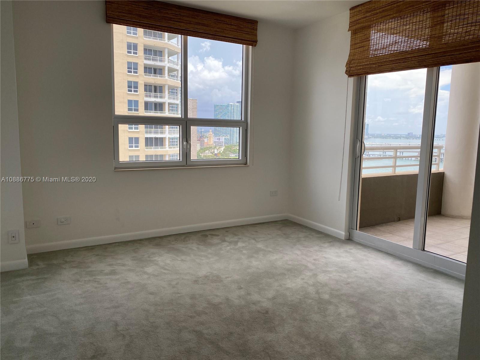 808 Brickell Key Drive, Unit 2601 Miami, FL 33131 - Photo 20 of 29 an empty room with windows
