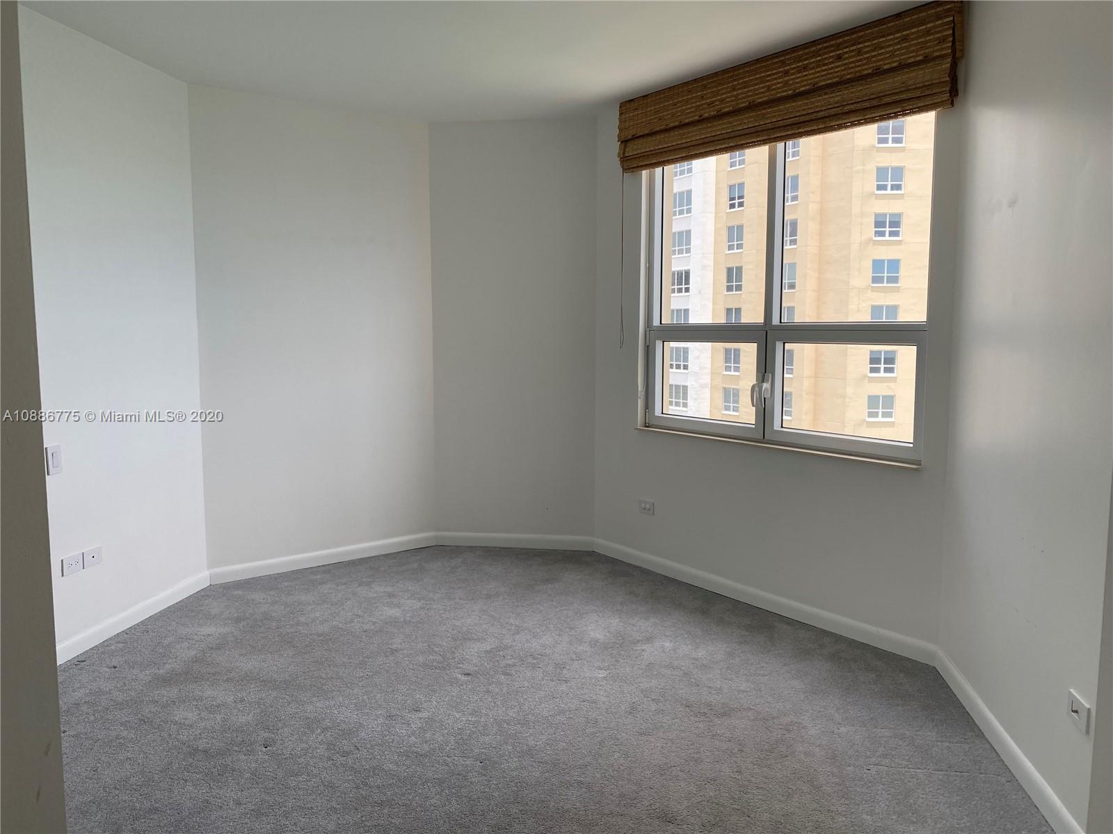 808 Brickell Key Drive, Unit 2601 Miami, FL 33131 - Photo 21 of 29 an empty room with a window