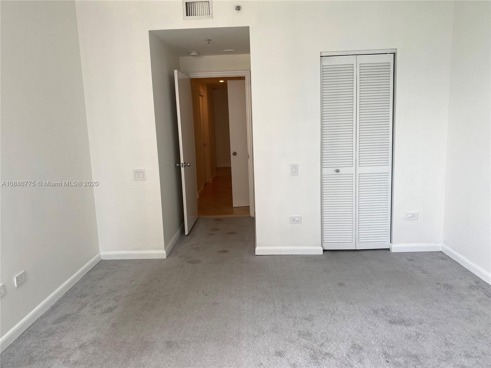 808 Brickell Key Drive, Unit 2601 Miami, FL 33131 - Photo 22 of 29 an empty room with closet