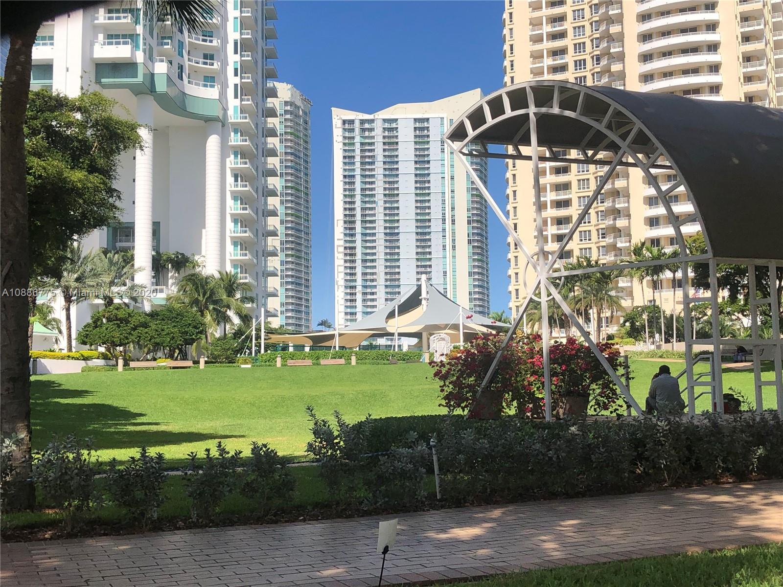 808 Brickell Key Drive, Unit 2601 Miami, FL 33131 - Photo 29 of 29 a front view of a house with a yard