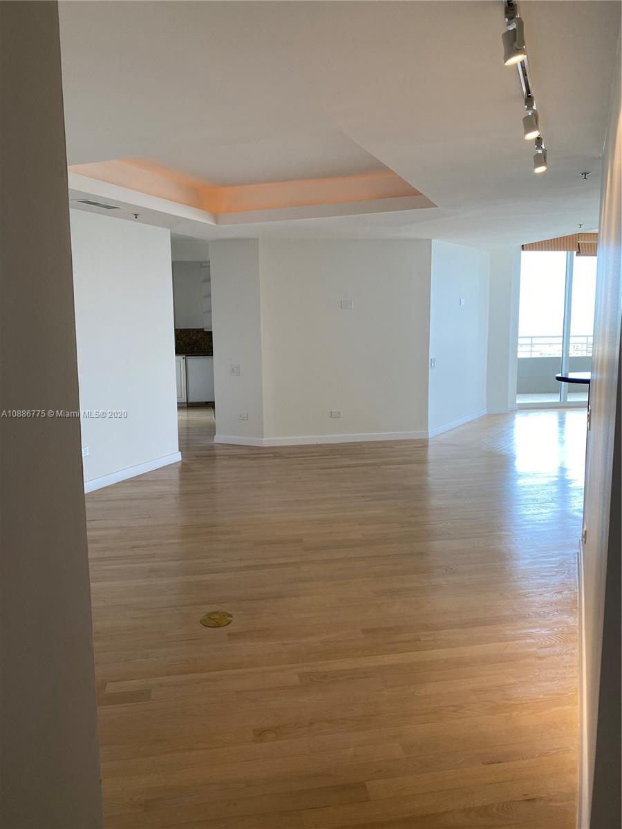 808 Brickell Key Drive, Unit 2601 Miami, FL 33131 - Photo 7 of 29 a view of empty room with wooden floor