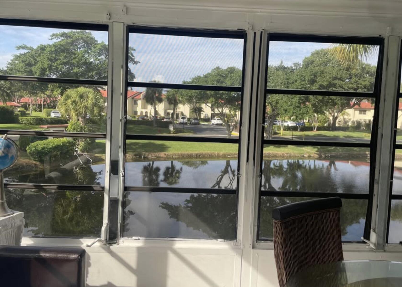 a glass window with lake view