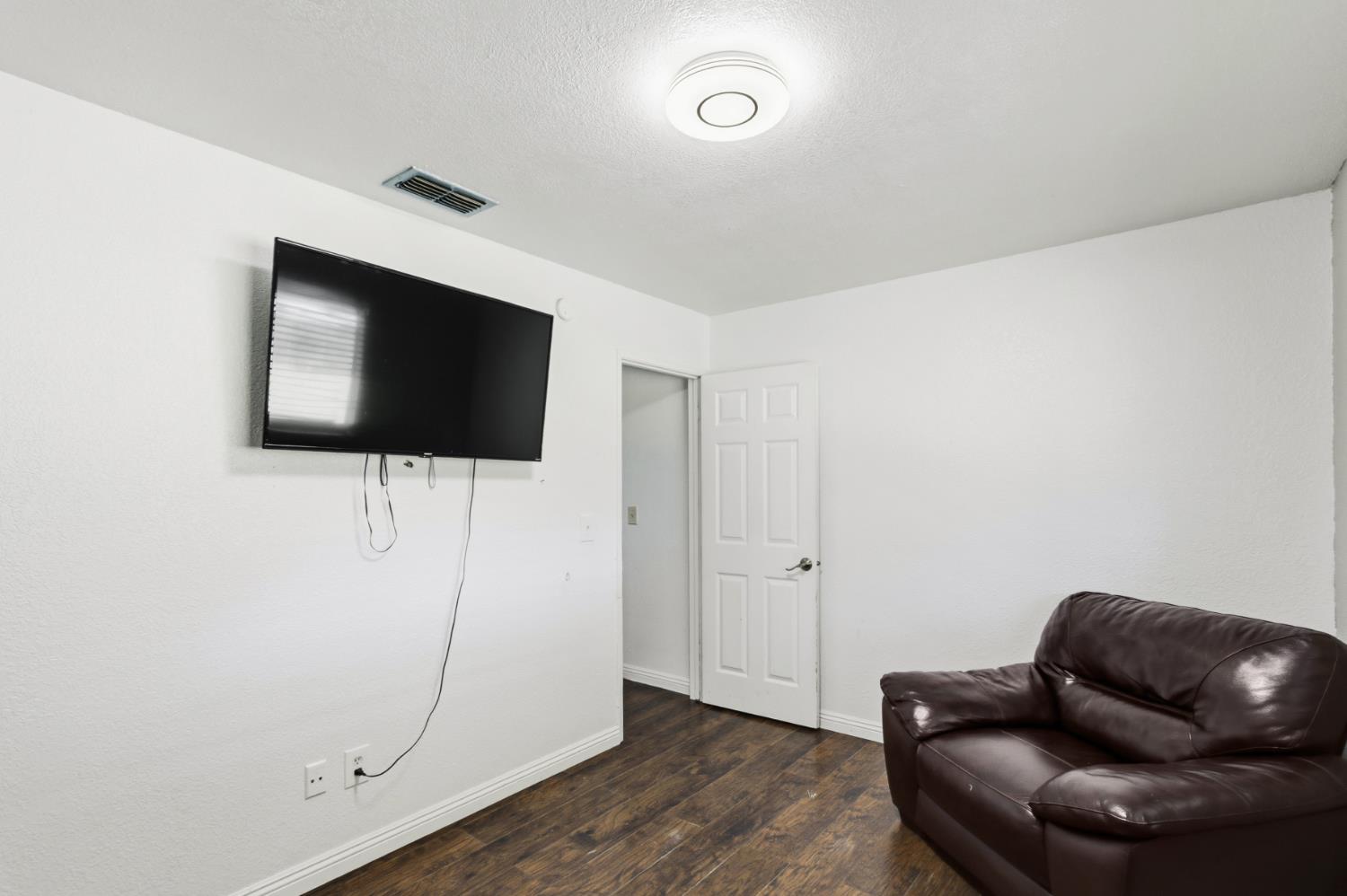 7208 7th Street Rio Linda, CA 95673 - Photo 22 of 41 a living room with furniture and a flat screen tv