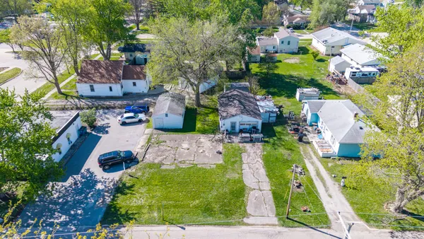 an aerial view of a house with a garden