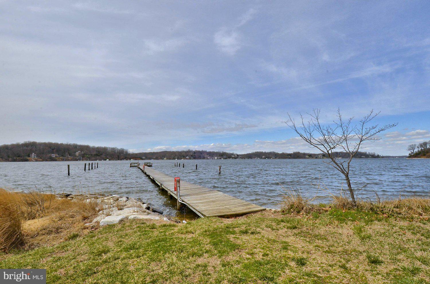 1518 Winchester Road Annapolis, MD 21409 - Photo 49 of 70 a view of a lake with beach in background