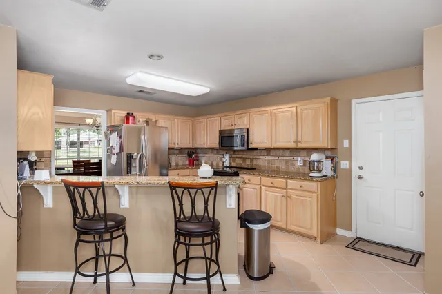a kitchen with refrigerator cabinets and a counter top space
